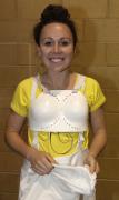 Chloe-puts on safety protectors for fencing  Image