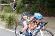 Eneko Llanos has a younfg companion race him on run leg Ironman Image